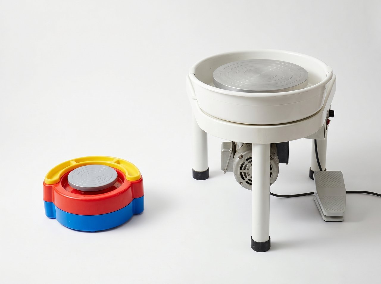 Side by side comparison of small plastic toy pottery wheel for kids versus full size adult pottery wheel with foot pedal showing dramatic size difference
